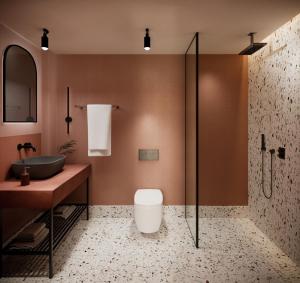 a bathroom with a shower and a toilet and a sink at Asteria in Katastárion