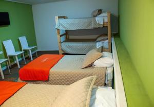 Postel nebo postele na pokoji v ubytování Hostal Casa Alegre