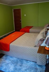 Postel nebo postele na pokoji v ubytování Hostal Casa Alegre