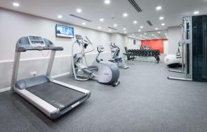 a gym with treadmills and cardio equipment in a room at Hilton Garden Inn Kuala Lumpur - North in Kuala Lumpur