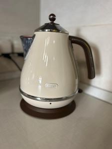 a white tea kettle sitting on top of a counter at Maltese town house in Valletta