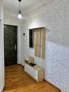 an empty room with a white wall and a door at Best choice in Kutaisi