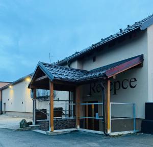 a building with a roof on the side of it at Hotel Hejtmanka in Mladá Boleslav