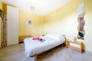 Postel nebo postele na pokoji v ubytování Maison Besun
