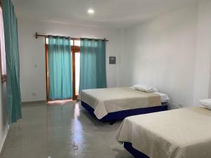 Voodi või voodid majutusasutuse Penguin House toas