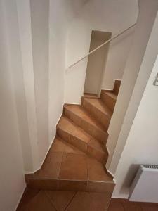 a staircase in a house with wooden floors at ZMRZLINOVÝ DOMEČEK (Ice cream housei) in Mikulov