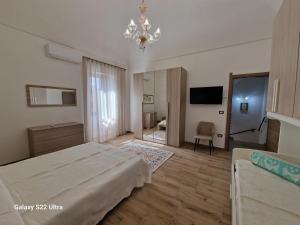 Säng eller sängar i ett rum på Palazzo Pisano Sorso-Tourist Rental