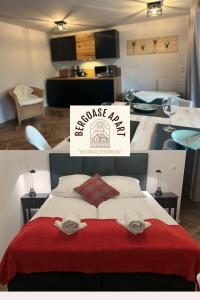 a bedroom with a large bed with a red blanket at BergOase-Apart am Feldberg in Feldberg