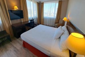 Postel nebo postele na pokoji v ubytování Hotel Diego de Almagro Lomas Verdes