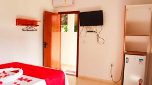 a room with a bed and a basketball hoop at Pousada Vila Jesuita in Cairu