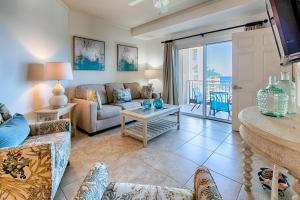 a living room with a couch and a table at Westwinds 4826 in Destin