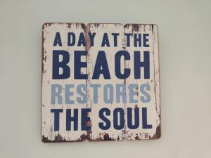 a day at the beach restores the soul sign at Peaceful 3 Bedroom House wFree Parking Nature in Falmer