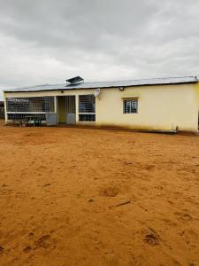 a building in the middle of a dirt field at TENDRY in Toliara