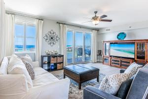 a living room with a couch and a tv at Ariel Dunes II 1701 in Destin