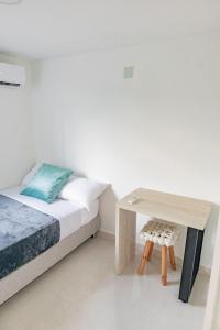 Krevet ili kreveti u jedinici u objektu Habitacion Triple Coveñas by Olamar Living