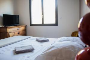 Postel nebo postele na pokoji v ubytování Grande villa avec vue et piscine