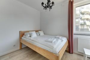 Postel nebo postele na pokoji v ubytování Szafarnia