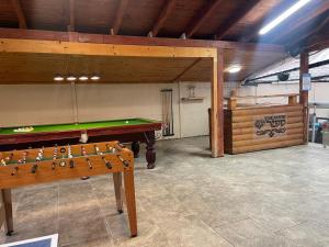 a pool table in the middle of a room at וילת אבן ספיר in Gefen