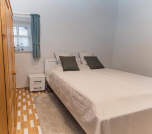 Postel nebo postele na pokoji v ubytování Pécsely House Apartman
