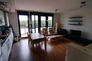 a kitchen and dining room with a table and chairs at Mirador Rioja alta golf in Cirueña +35 photos