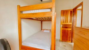 a bedroom with two bunk beds and a closet at Lar Lalunalê 3 in Prado