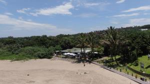 an aerial view of a beach with a resort at Seaside, Marina Beach in Marina Beach +37 photos