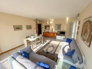 a living room with two couches and a table at [Esclusivo 120 MQ] nel cuore di Bergamo in Bergamo +18 photos