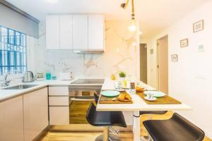 a kitchen with a table with food on it at CARTAGENAFLATS, Apartamentos Anfiteatro Romano in Cartagena