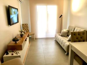 a living room with a couch and a table at Lo de Chany in San Juan +13 photos