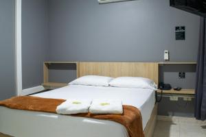 Voodi või voodid majutusasutuse Hotel Ruiseñor Itagui toas