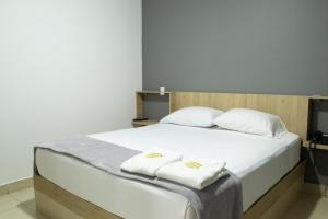 Voodi või voodid majutusasutuse Hotel Ruiseñor Itagui toas