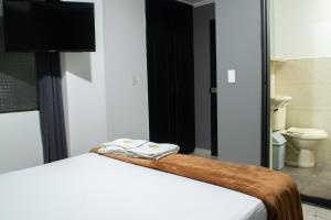 Voodi või voodid majutusasutuse Hotel Ruiseñor Itagui toas