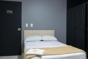 Voodi või voodid majutusasutuse Hotel Ruiseñor Itagui toas