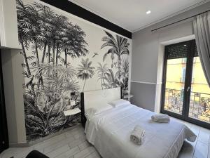 Łóżko lub łóżka w pokoju w obiekcie Parthenope Rooms