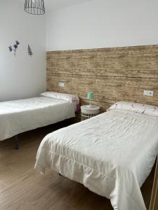 Ein Bett oder Betten in einem Zimmer der Unterkunft Bajo casa en Moaña
