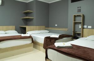 Voodi või voodid majutusasutuse Hotel Ruiseñor Itagui toas