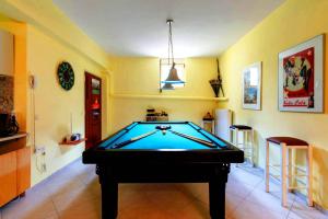 a room with a pool table in a room at Vacation_Studio_near_the_beach in Heraklio