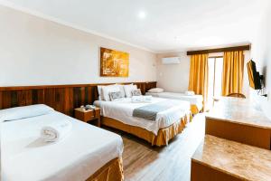 Postel nebo postele na pokoji v ubytování Thermas Hotel Mossoró