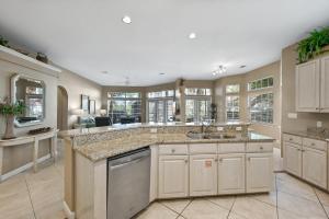 a large kitchen with marble counter tops and windows at Tivoli 5258 in Destin