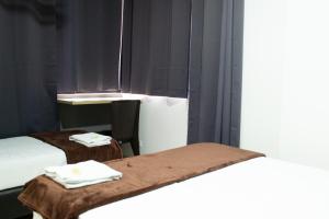 Voodi või voodid majutusasutuse Hotel Ruiseñor Itagui toas