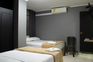 Voodi või voodid majutusasutuse Hotel Ruiseñor Itagui toas