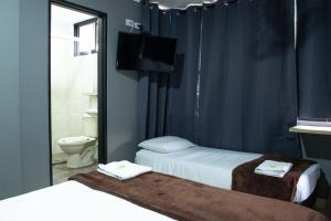 Voodi või voodid majutusasutuse Hotel Ruiseñor Itagui toas