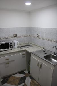 Kuchyň nebo kuchyňský kout v ubytování Killary Apart Hotel