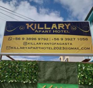 a sign for a khalifa airport hotel at Killary Apart Hotel in Antofagasta