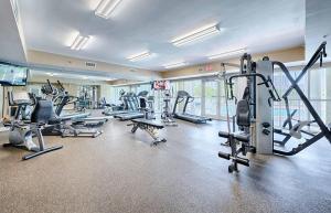a gym with several treadmills and machines in it at Ariel Dunes II 602 in Destin