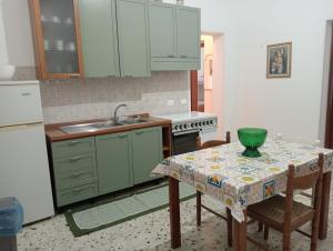 A kitchen or kitchenette at Casa Vacanze L'ULIVO