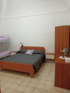 A bed or beds in a room at Casa Vacanze L'ULIVO