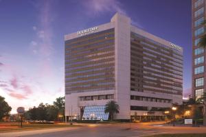 a building with a sign on the side of it at DoubleTree by Hilton Orlando Downtown in Orlando