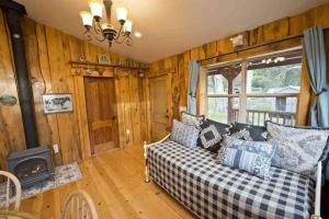 a living room with a couch and a fireplace at Pacific Coast Highway Milkhouse in San Luis Obispo +40 photos