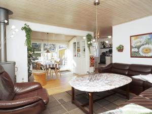 a living room with a couch and a table at Holiday home Vig L in Vig